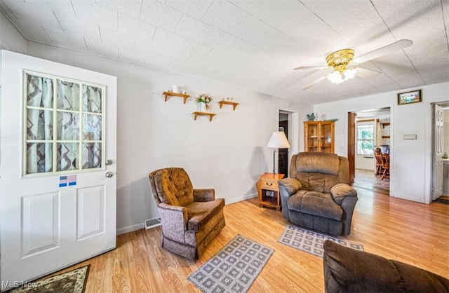 1016 W 55th St, Ashtabula, OH 44004 - living room featuring wood finished floors and ceiling fan