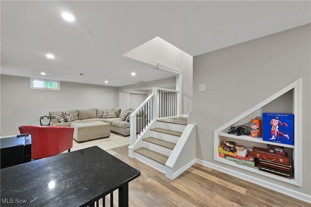 195 Sleepy Hollow Dr, Amherst, OH 44001 - living area with stairs, wood finished floors, and recessed lighting