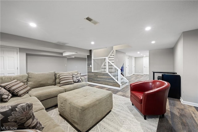 195 Sleepy Hollow Dr, Amherst, OH 44001 - living room with wood finished floors, stairs, and recessed lighting