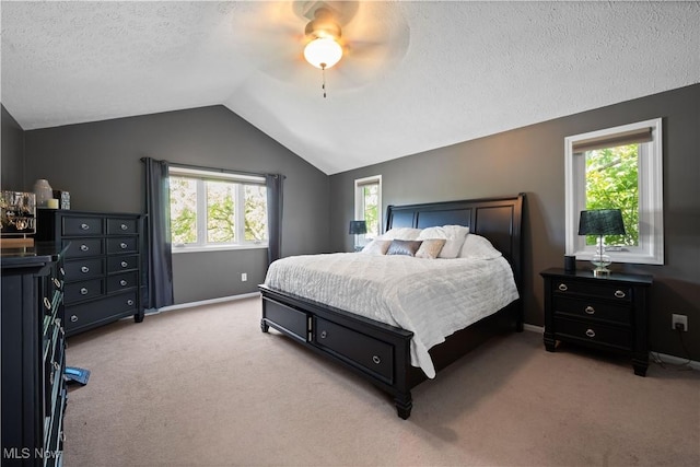 195 Sleepy Hollow Dr, Amherst, OH 44001 - bedroom featuring light colored carpet, vaulted ceiling, a textured ceiling, and ceiling fan