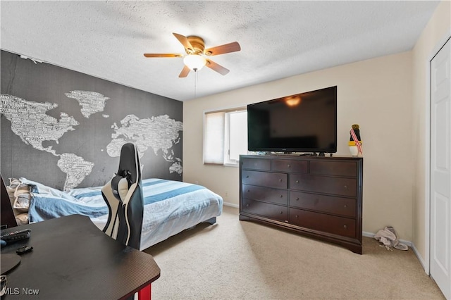 195 Sleepy Hollow Dr, Amherst, OH 44001 - bedroom with a textured ceiling, a ceiling fan, and light colored carpet
