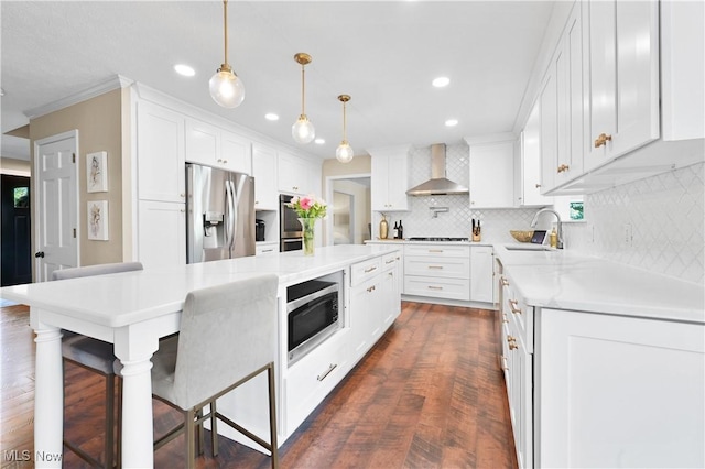 195 Sleepy Hollow Dr, Amherst, OH 44001 - kitchen featuring appliances with stainless steel finishes, wall chimney range hood, backsplash, recessed lighting, and light countertops