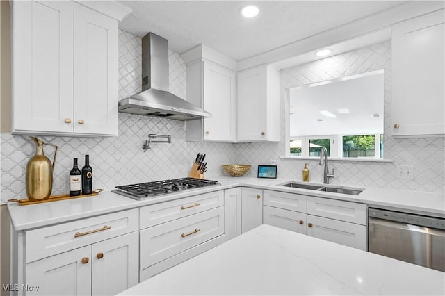 195 Sleepy Hollow Dr, Amherst, OH 44001 - kitchen with wall chimney range hood, stainless steel appliances, white cabinetry, tasteful backsplash, and recessed lighting
