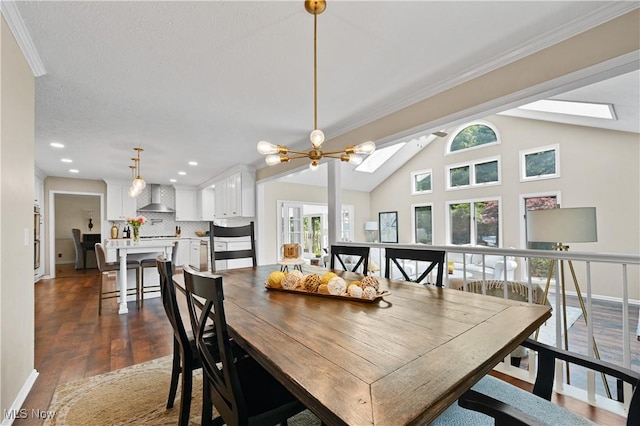 195 Sleepy Hollow Dr, Amherst, OH 44001 - dining room featuring a skylight, dark wood finished floors, lofted ceiling, recessed lighting, and ornamental molding