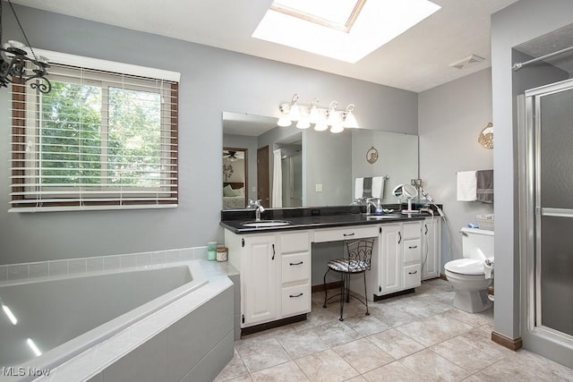 31382 Saint Andrews, Westlake, OH 44145 - full bath featuring double vanity, a bath, a skylight, tile patterned floors, and an enclosed shower