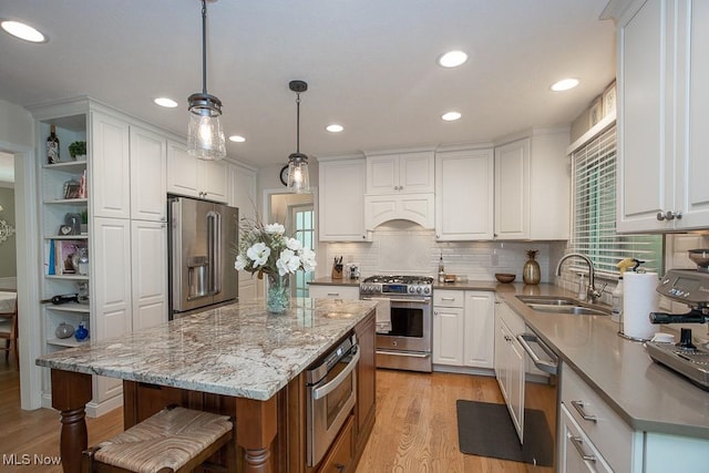 31382 Saint Andrews, Westlake, OH 44145 - kitchen with appliances with stainless steel finishes, white cabinets, light wood-type flooring, and recessed lighting