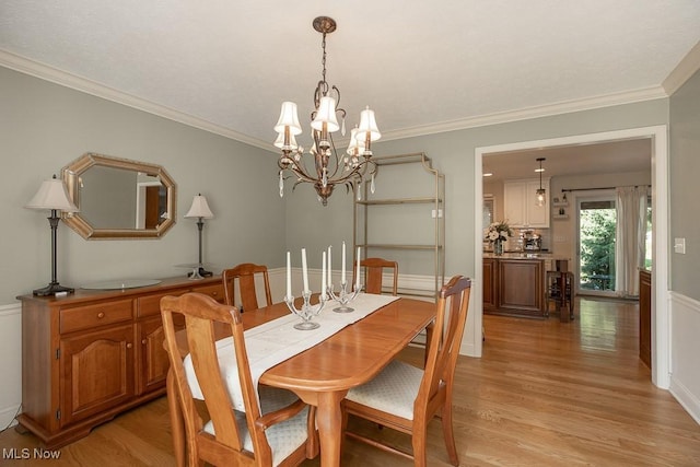 31382 Saint Andrews, Westlake, OH 44145 - dining area with a chandelier, light wood-style flooring, and ornamental molding