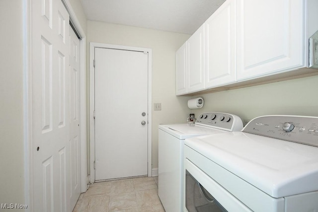 31382 Saint Andrews, Westlake, OH 44145 - laundry area featuring washing machine and dryer and cabinet space