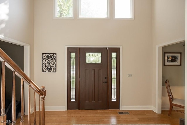 31382 Saint Andrews, Westlake, OH 44145 - foyer entrance featuring a high ceiling, wood finished floors, and stairway