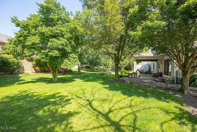 31382 Saint Andrews, Westlake, OH 44145 - view of green lawn with a patio