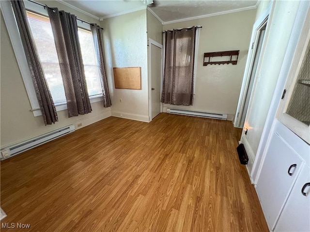 1030 Saint George St, East Liverpool, OH 43920 - unfurnished bedroom with a baseboard radiator, ornamental molding, and wood finished floors