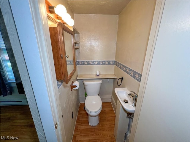 1030 Saint George St, East Liverpool, OH 43920 - bathroom with wood finished floors and baseboard heating