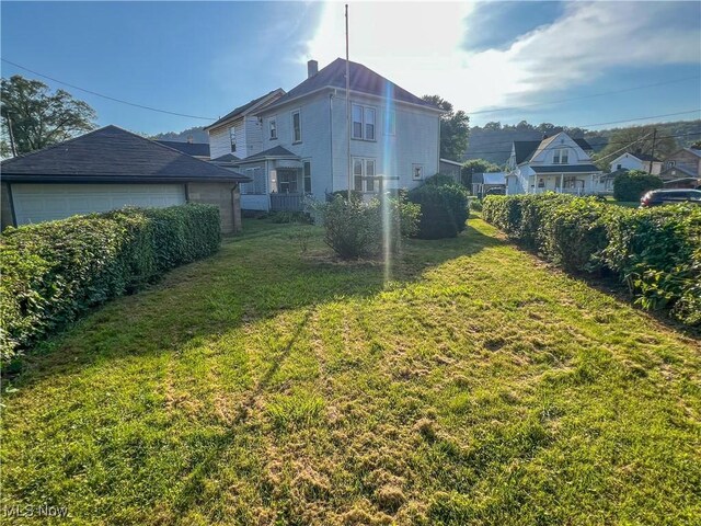 1030 Saint George St, East Liverpool, OH 43920 - view of yard featuring a detached garage