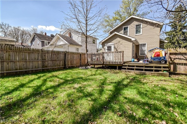 37 S Cedar St, Geneva, OH 44041 - back of property with a wooden deck and a fenced backyard