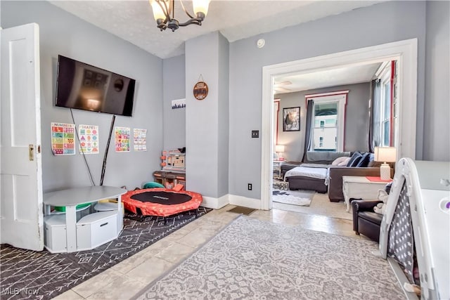 37 S Cedar St, Geneva, OH 44041 - rec room with a chandelier and baseboards