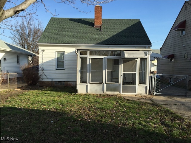 4211 Torrington Ave, Parma, OH 44134 - rear view of property with a sunroom, roof with shingles, a chimney, and a gate