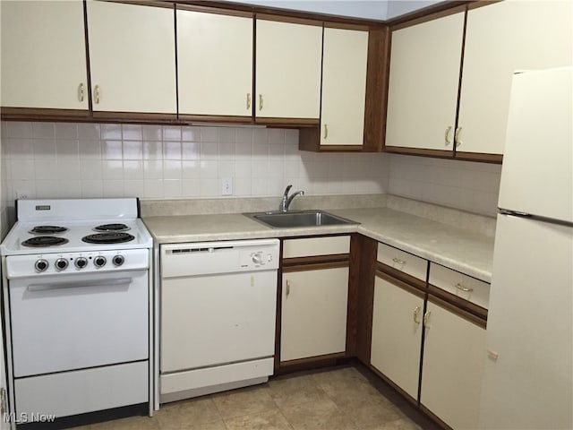 4211 Torrington Ave, Parma, OH 44134 - kitchen with white appliances, light countertops, and backsplash