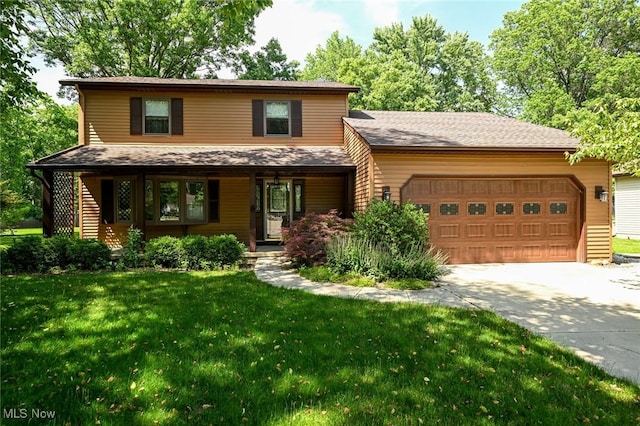 26788 Skyline Dr, Olmsted Twp, OH 44138 - view of front of house featuring driveway, an attached garage, a front lawn, and covered porch