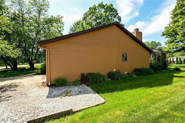 26788 Skyline Dr, Olmsted Twp, OH 44138 - view of home's exterior featuring a lawn and a chimney