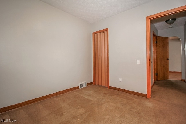 105 Tudor Ave, Bedford, OH 44146 - unfurnished room with light carpet and a textured ceiling
