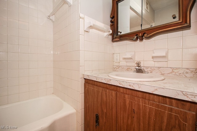 105 Tudor Ave, Bedford, OH 44146 - full bath with vanity, backsplash, and  shower combination