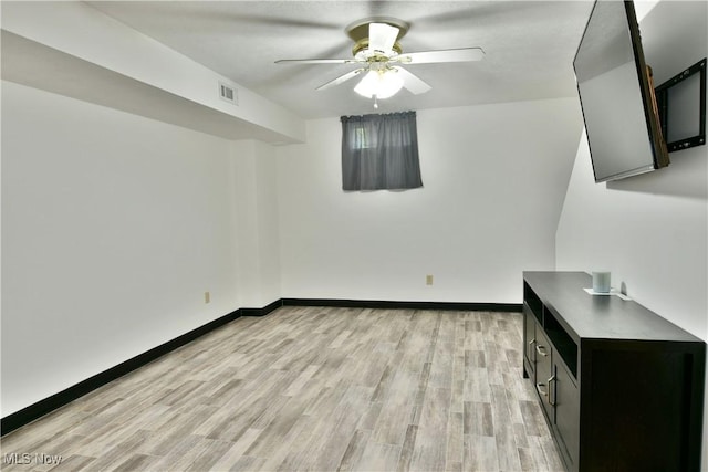 3189 Woodland Trl Unit A, Cortland, OH 44410 - unfurnished living room featuring ceiling fan and light wood finished floors