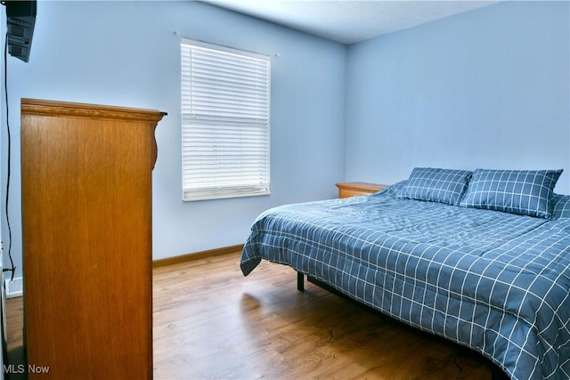 3189 Woodland Trl Unit A, Cortland, OH 44410 - bedroom with wood finished floors and baseboards