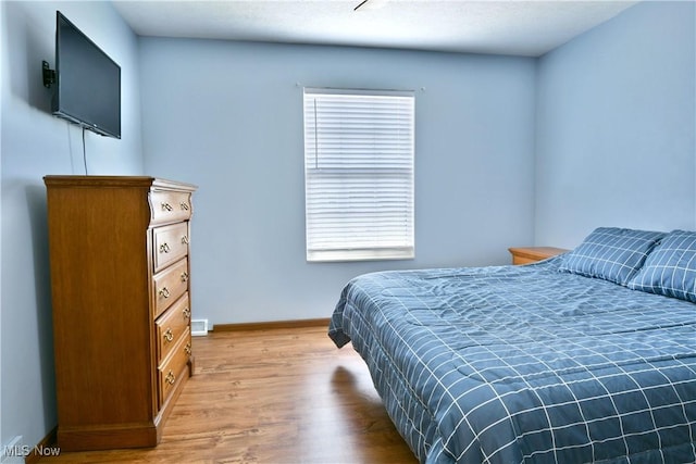 3189 Woodland Trl Unit A, Cortland, OH 44410 - bedroom with light wood finished floors and baseboards