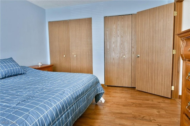 3189 Woodland Trl Unit A, Cortland, OH 44410 - bedroom with wood finished floors and two closets