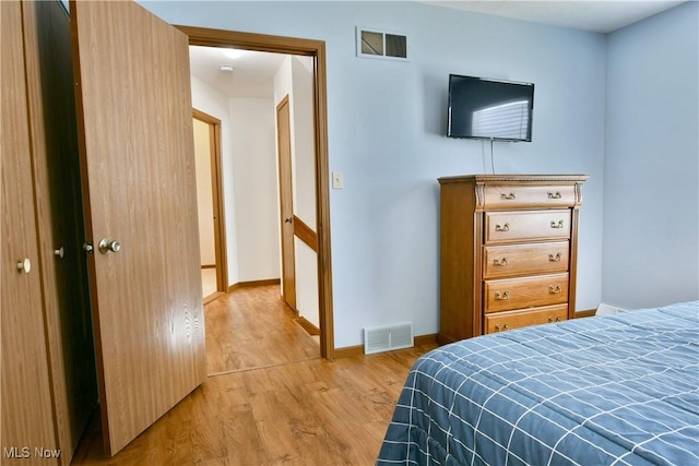 3189 Woodland Trl Unit A, Cortland, OH 44410 - bedroom with light wood-style floors and baseboards
