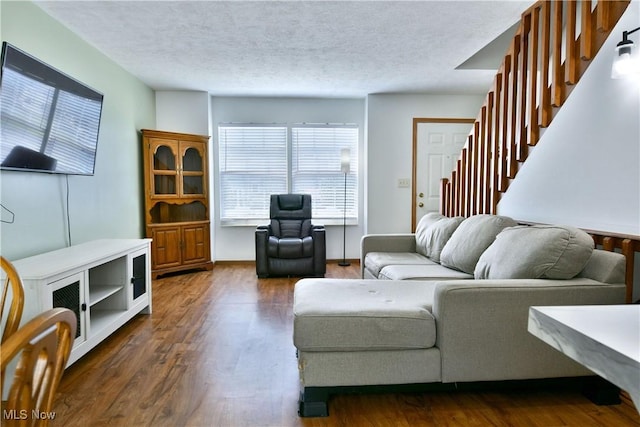 3189 Woodland Trl Unit A, Cortland, OH 44410 - living area with a textured ceiling, stairway, and dark wood finished floors