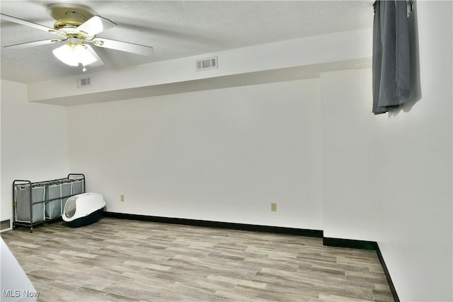 3189 Woodland Trl Unit A, Cortland, OH 44410 - unfurnished bedroom featuring wood finished floors and ceiling fan