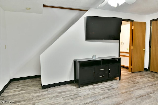3189 Woodland Trl Unit A, Cortland, OH 44410 - unfurnished living room with ceiling fan and light wood finished floors