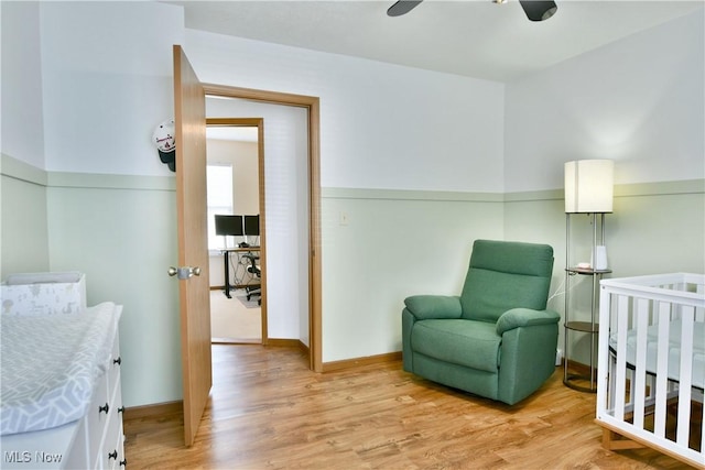 3189 Woodland Trl Unit A, Cortland, OH 44410 - bedroom with light wood-style floors, a nursery area, and a ceiling fan