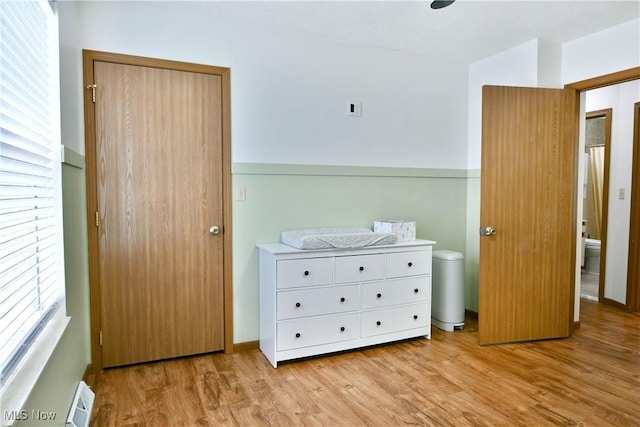 3189 Woodland Trl Unit A, Cortland, OH 44410 - bedroom featuring light wood finished floors and a baseboard radiator