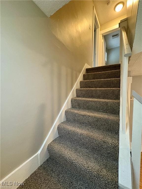 309 Emma St, Niles, OH 44446 - staircase with a textured ceiling
