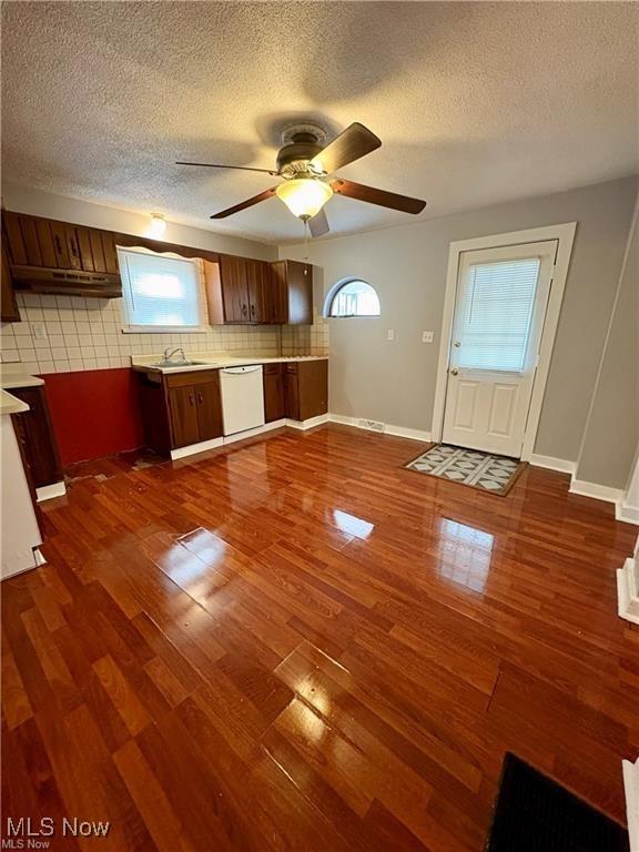 309 Emma St, Niles, OH 44446 - kitchen featuring dishwasher, tasteful backsplash, dark wood-type flooring, a textured ceiling, and a ceiling fan