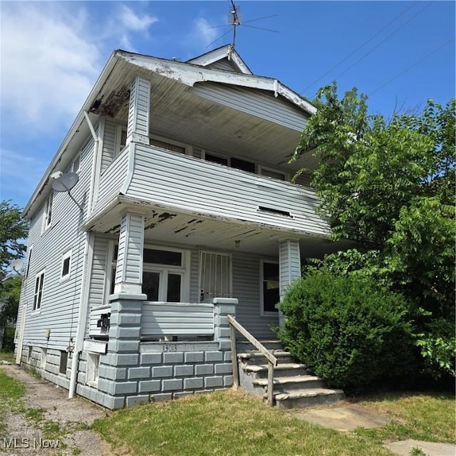 13013 Soika Ave, Cleveland, OH 44120 - view of front of home with a porch and a balcony