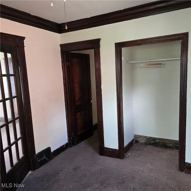 13013 Soika Ave, Cleveland, OH 44120 - unfurnished bedroom featuring ornamental molding, carpet, and a closet
