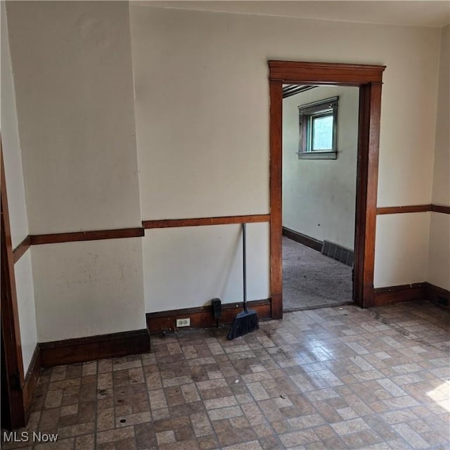 13013 Soika Ave, Cleveland, OH 44120 - spare room with baseboards and brick patterned floors