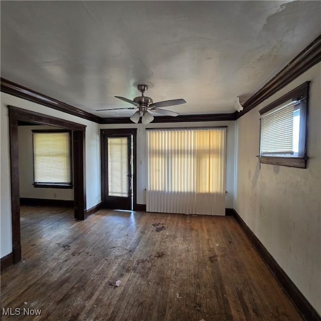 13013 Soika Ave, Cleveland, OH 44120 - empty room featuring crown molding, healthy amount of natural light, wood finished floors, and a ceiling fan