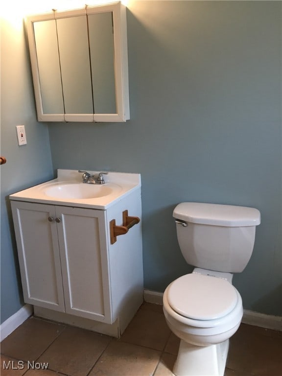 3439 Tuxedo Ave, Parma, OH 44134 - half bath featuring vanity and tile patterned flooring