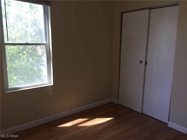 3439 Tuxedo Ave, Parma, OH 44134 - unfurnished bedroom with wood finished floors and a closet