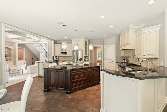 3880 Waterford Ct, Orange, OH 44122 - kitchen featuring appliances with stainless steel finishes, dark brown cabinetry, recessed lighting, tasteful backsplash, and dark stone countertops