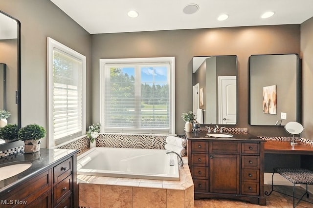 3880 Waterford Ct, Orange, OH 44122 - full bath with two vanities, a garden tub, and recessed lighting