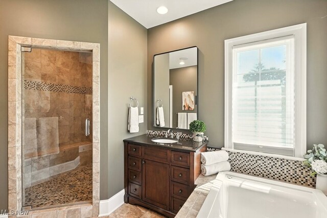 3880 Waterford Ct, Orange, OH 44122 - full bath featuring a garden tub, a shower stall, and vanity