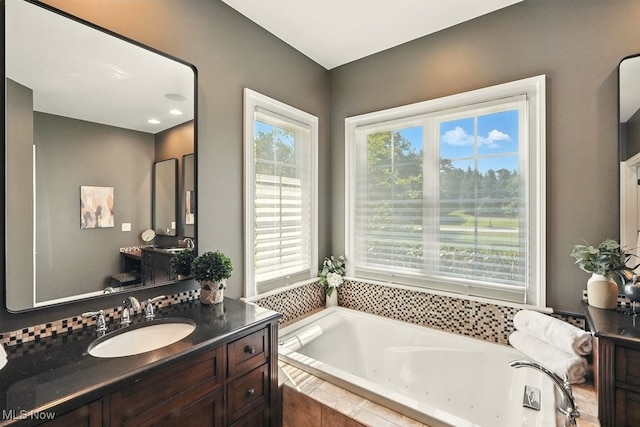 3880 Waterford Ct, Orange, OH 44122 - bathroom with a tub with jets and vanity