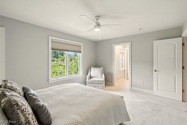 3880 Waterford Ct, Orange, OH 44122 - bedroom with light colored carpet, ceiling fan, and ensuite bath