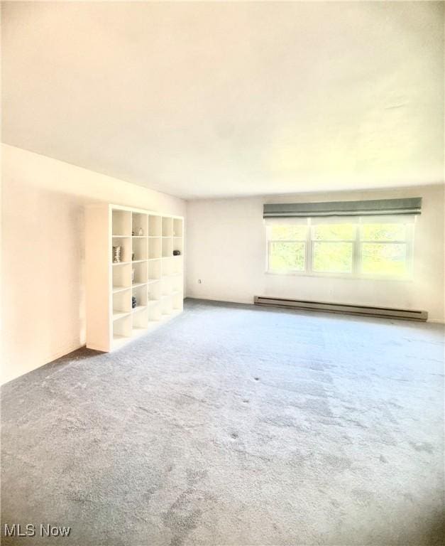 1104 Lantern, East Liverpool, OH 43920 - carpeted spare room featuring a baseboard heating unit