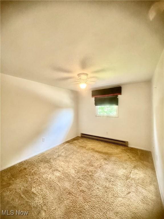 1104 Lantern, East Liverpool, OH 43920 - carpeted spare room featuring a baseboard heating unit and a ceiling fan